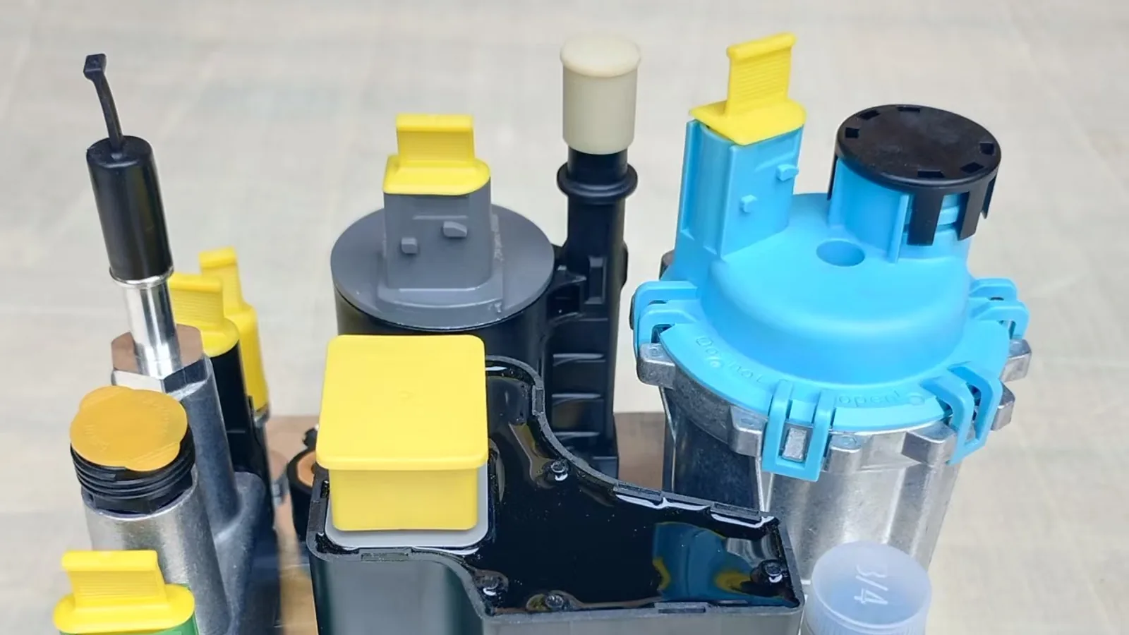 Heavy truck urea dosing pump assembly with protected ports and connectors