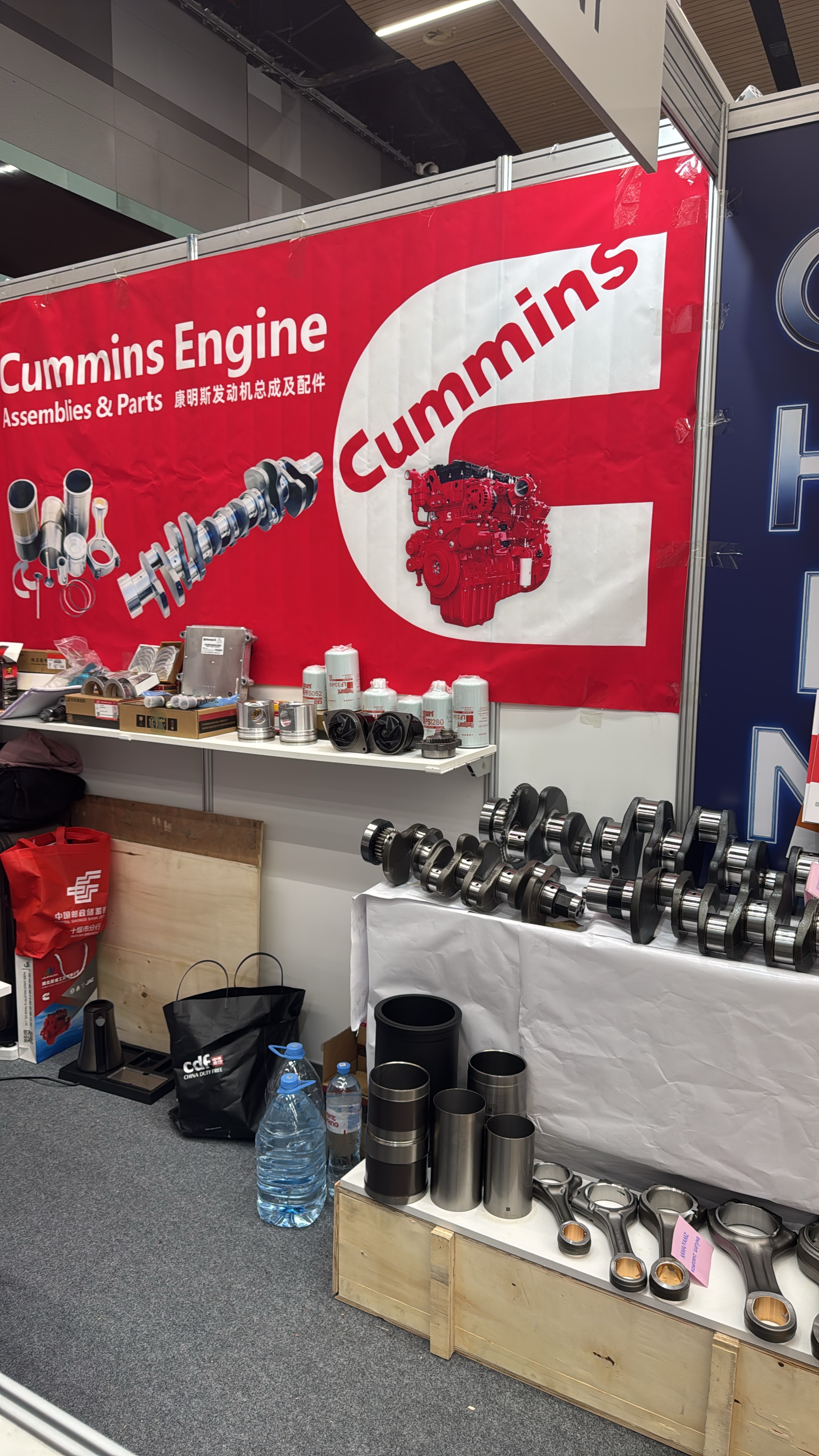 Guanda Engine Division displaying Cummins engine assemblies, forged crankshafts, cylinder liners, and electronic control units