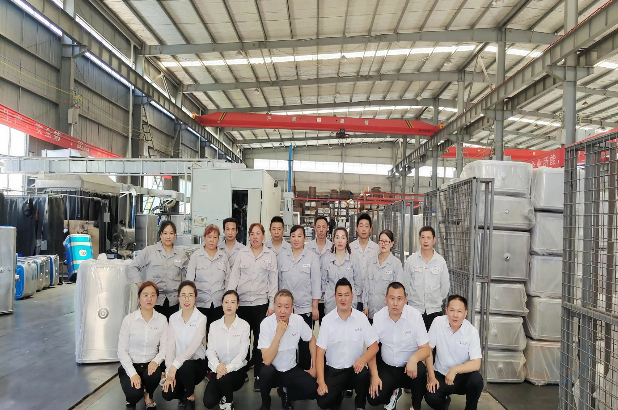 Guanda team photo inside the workshop