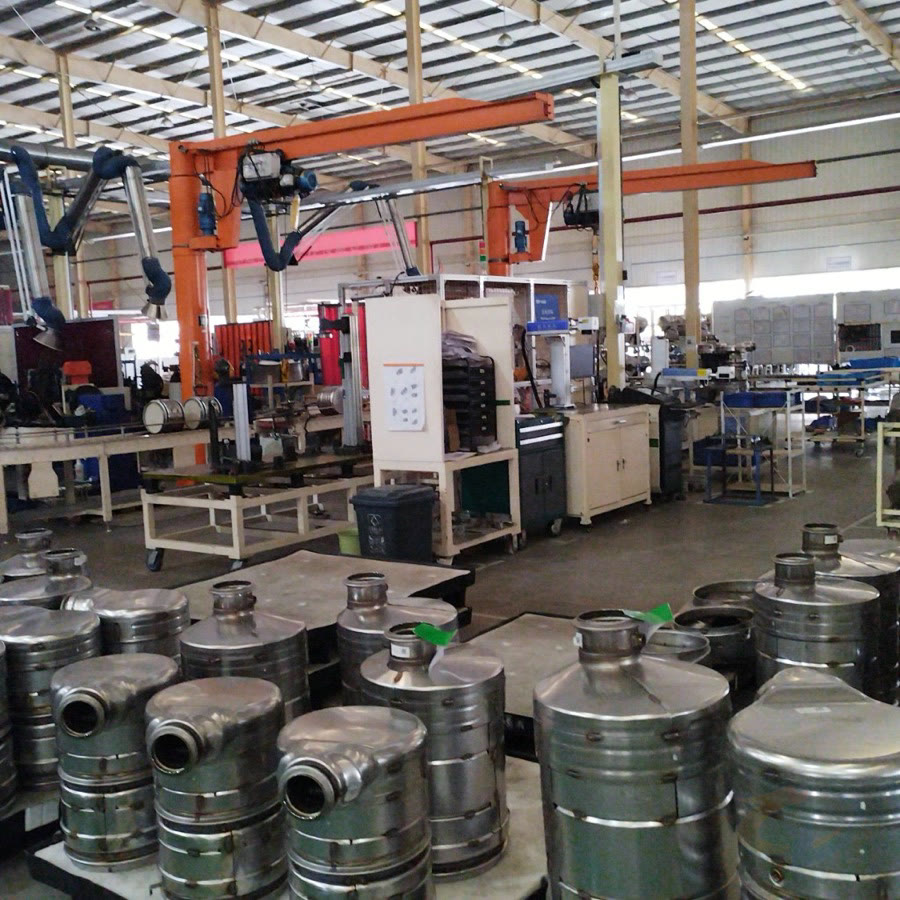 Workshop overview with metal truck component assemblies