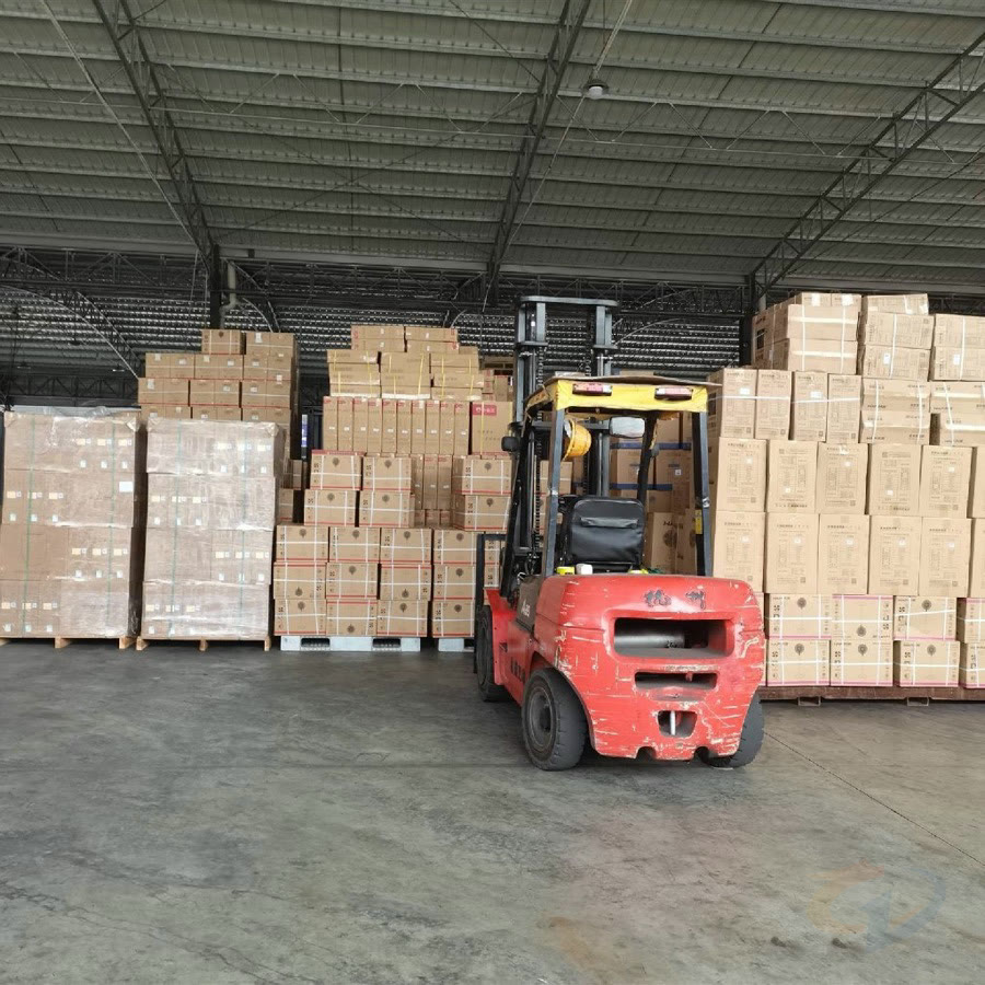 Warehouse with forklift and stacked export cartons